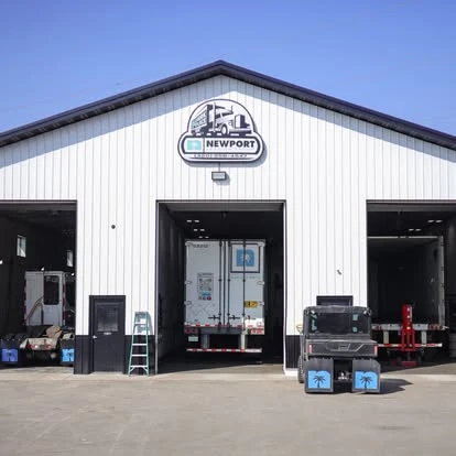 The Newport shop exterior with open service bays