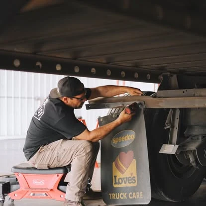 A Newport technician working on trailer components